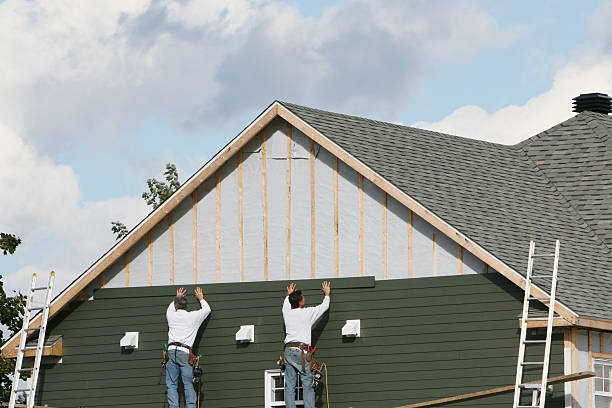 Professional Emergency Siding Repair technician working in Burton, OH